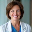 Portrait of Dr. Eleanor Vance, a smiling woman in her late 40s, professional and approachable