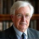 Portrait of Professor Arthur Kim, a distinguished man in his early 50s, thoughtful and experienced